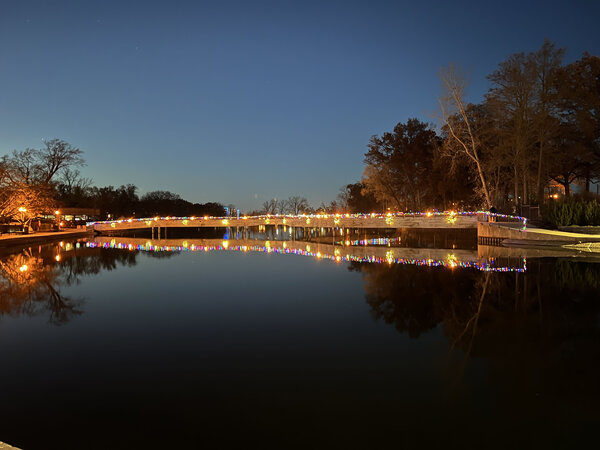The footbridge glowing into blue hour