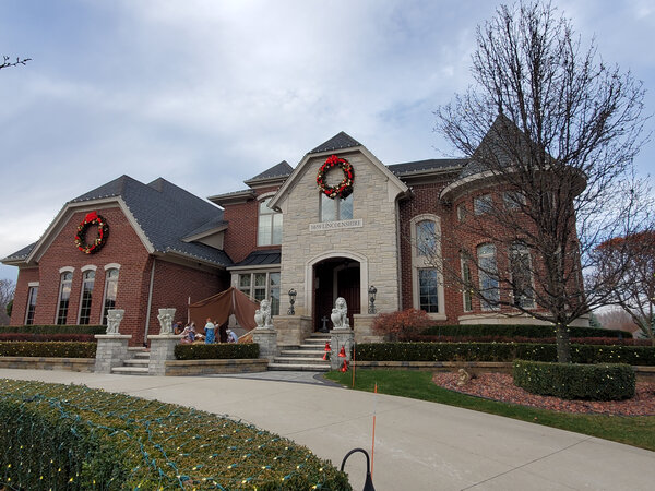 A grand facade in red-bowed wreaths