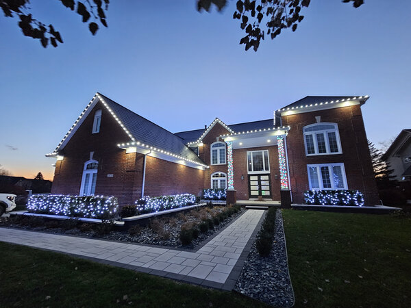 Crisp eaves and beds at blue hour