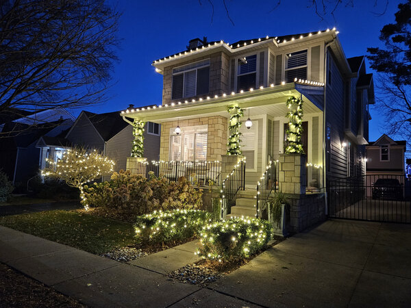 Outlined eaves over a garlanded porch
