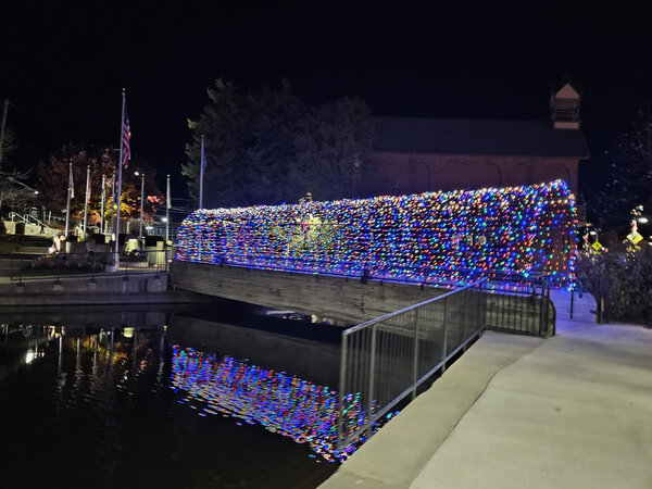 The footbridge mirrored in still water