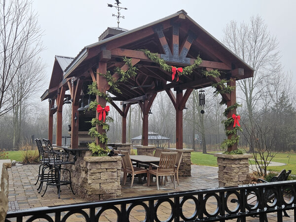 A timber pavilion swagged in garland