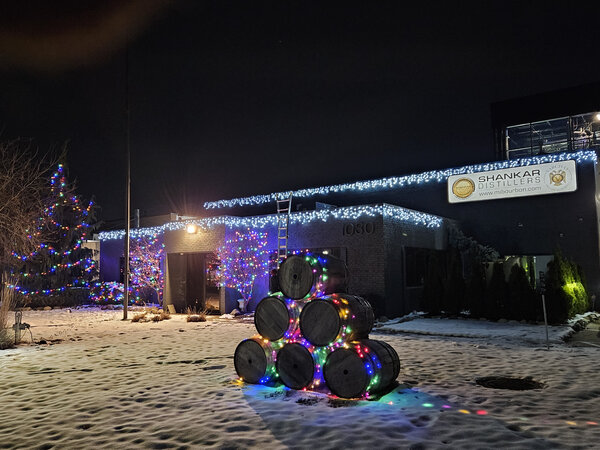 A pyramid of glowing barrels in the snow