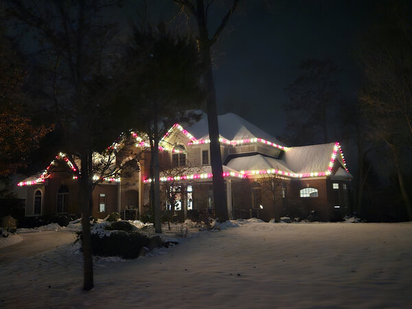 Red-and-white eaves on a snowy night