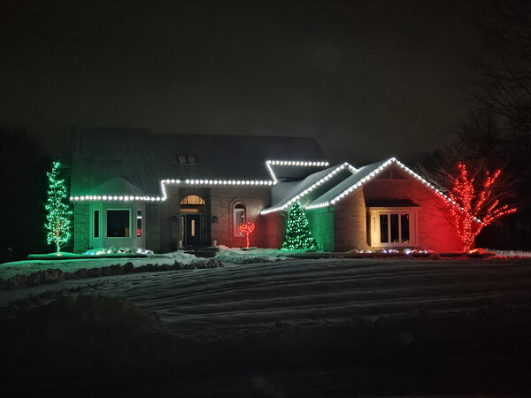 Red and green sentinels flank the eaves