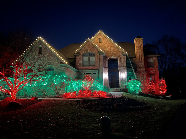 A red-and-green landscape under warm eaves